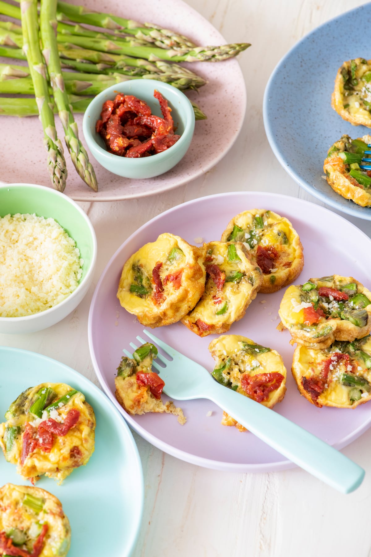 Baby frittatas on serving plates.