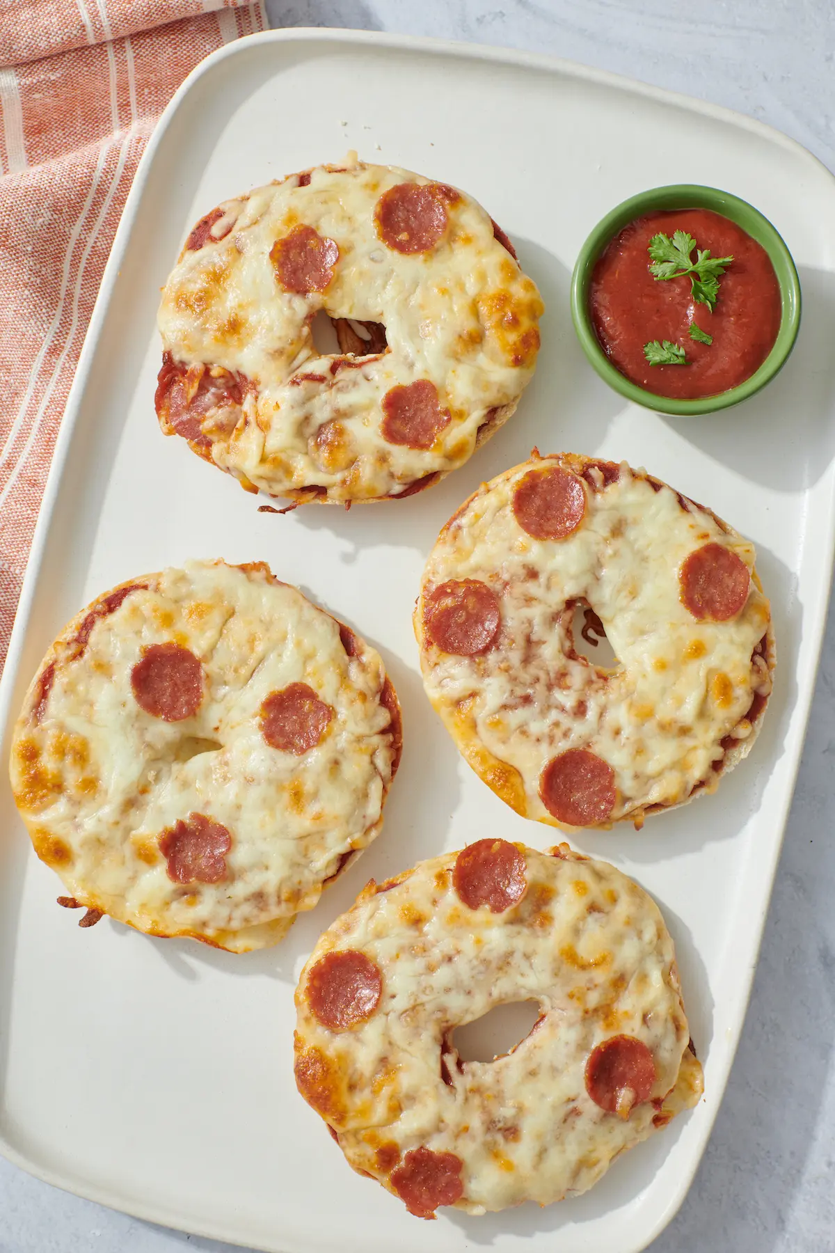 pizza bagels on serving tray