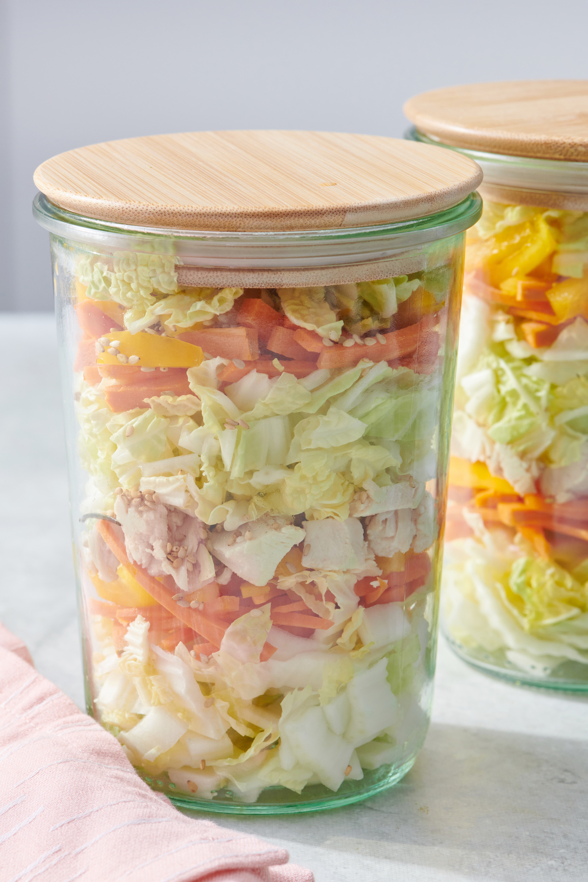 Jars with meal prepped Chinese Chicken Salad.