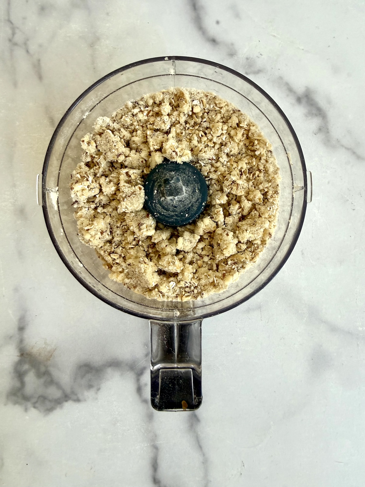Oat crumble topping pulsed to a sandy, clumpy texture in a food processor.