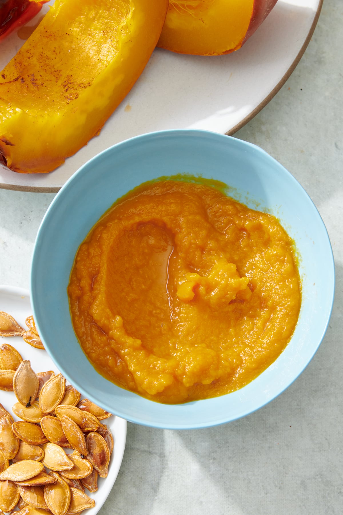 Roast pumpin puree in small blue bowl.