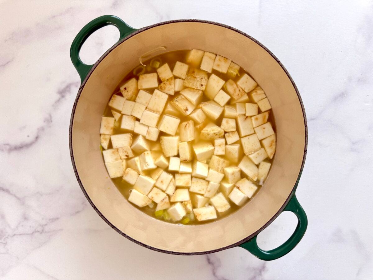 Celery root soup ingredients simmering before being blended.