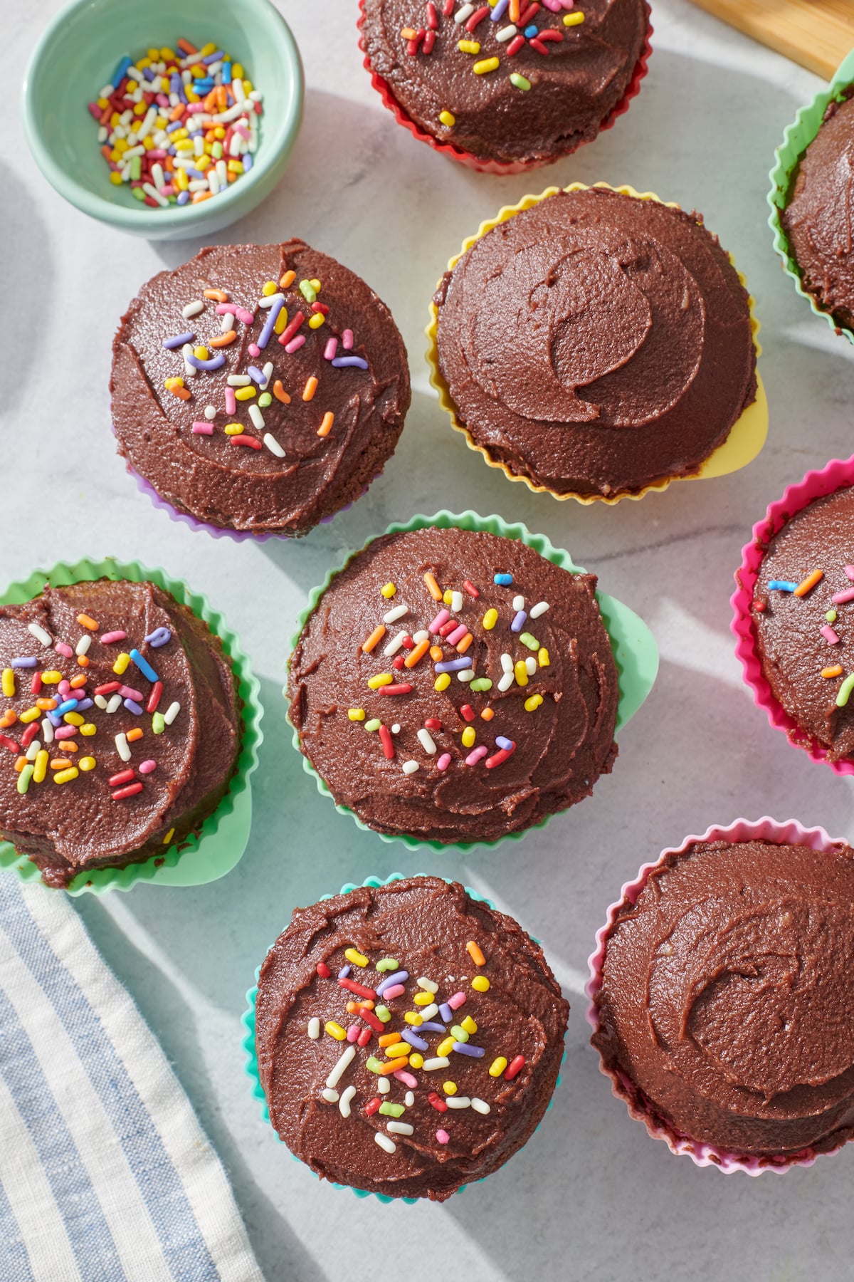 overhead of chocolate cupcakes with sprinkles