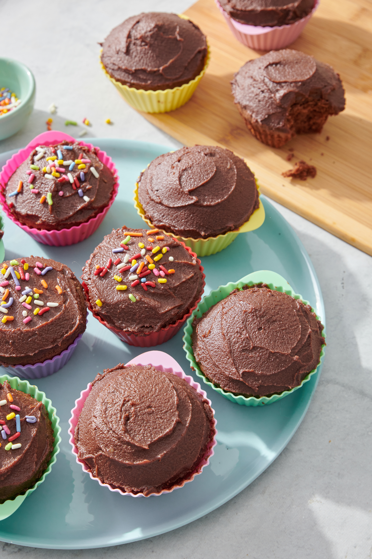 dark chocolate cupcakes on blue serving plate