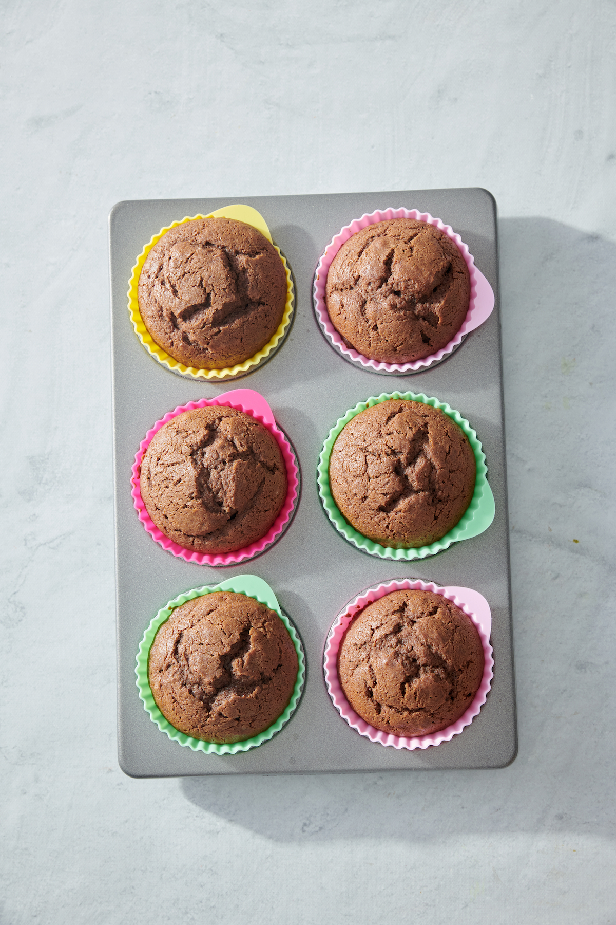 chocolate cupcakes in muffin tin with no frosting