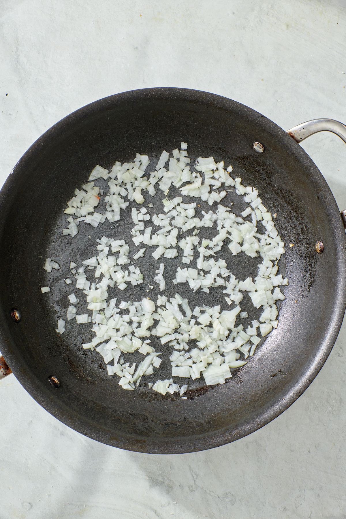 Sautéed onion in a pan.