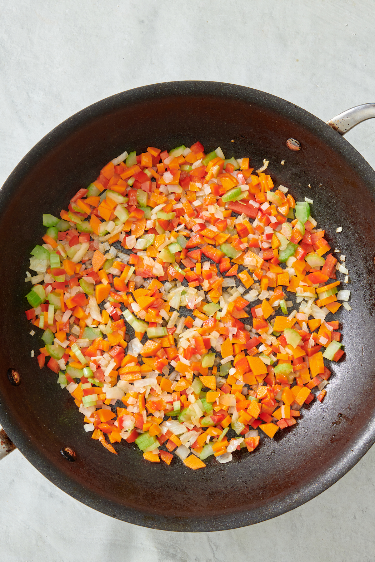 Sautéed vegetables in a pan.