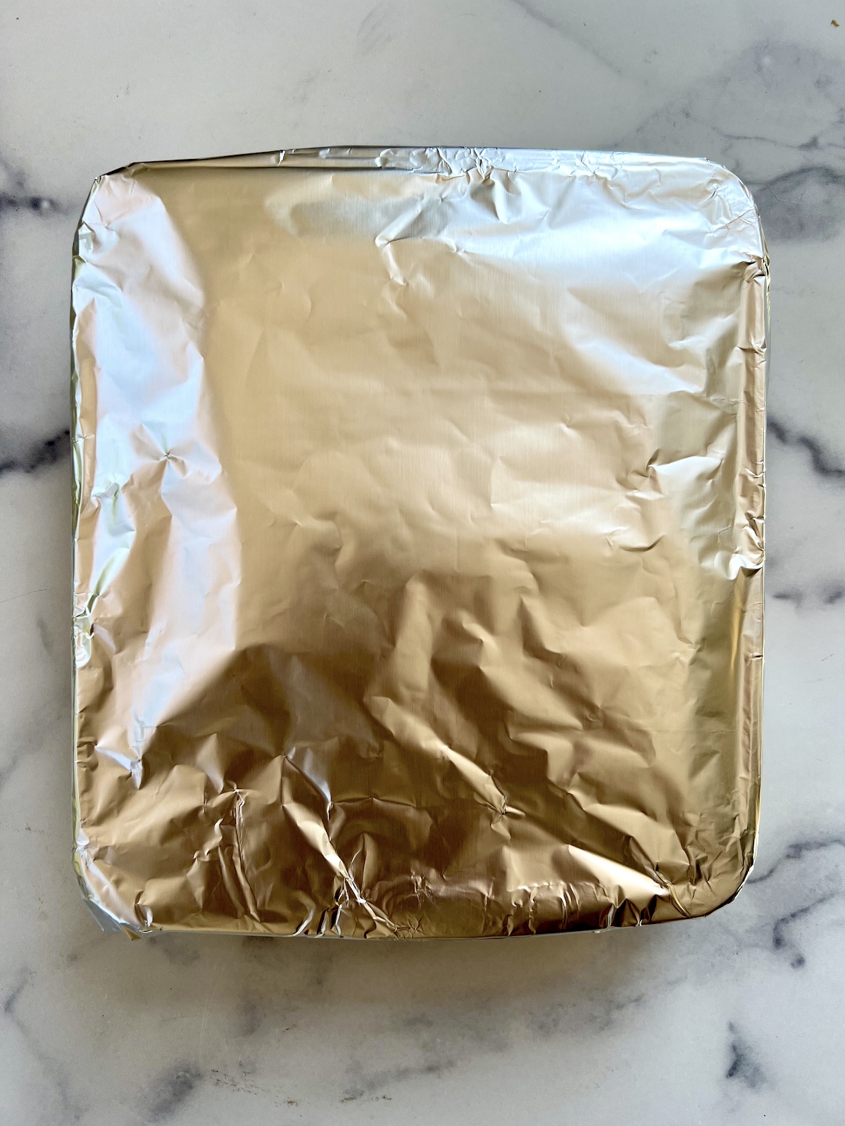 Baking dish covered with aluminum foil.
