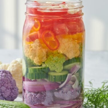 Homemade pickled vegetables in a mason jar.