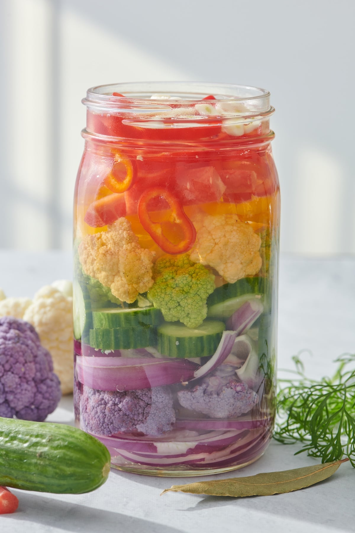 Homemade pickled vegetables in a mason jar.