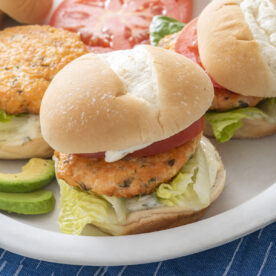 A salmon burger on a plate.