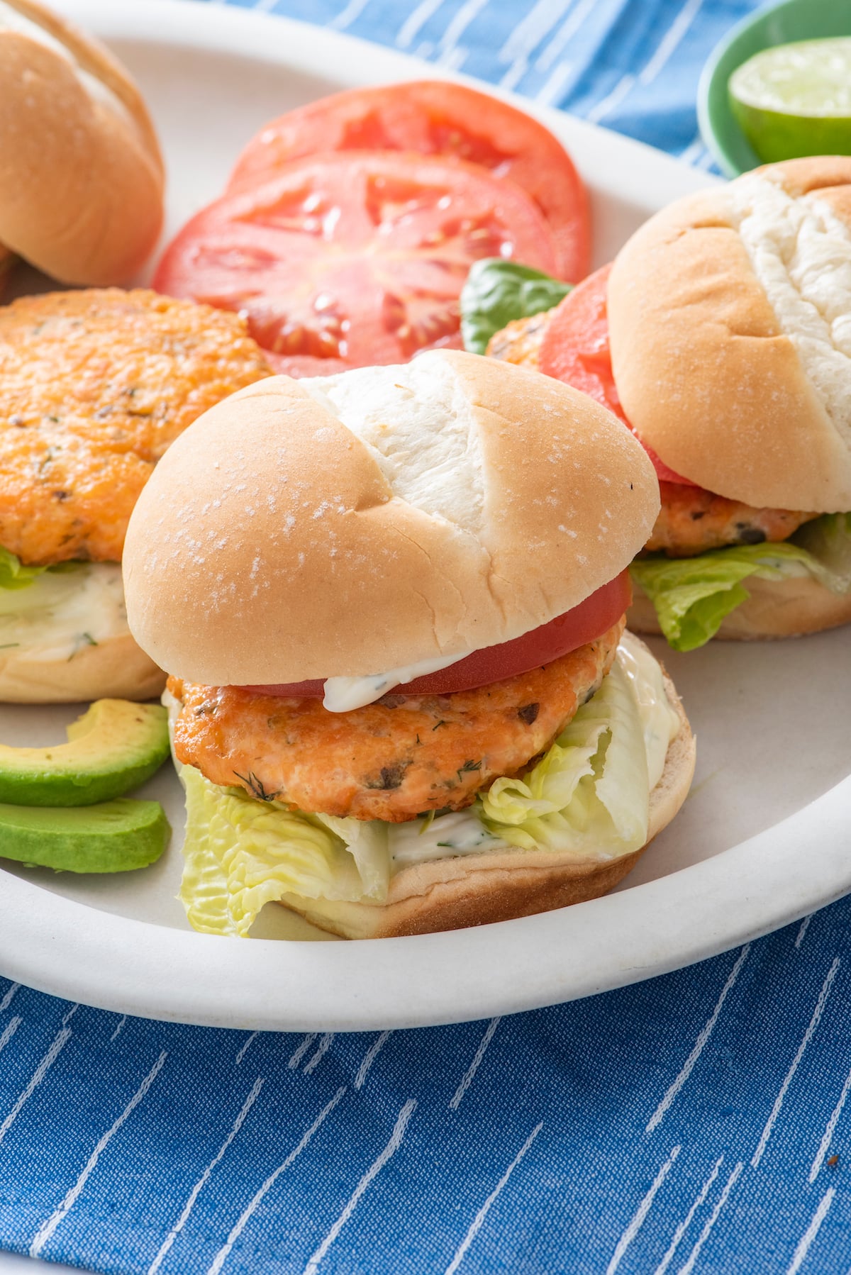 A salmon burger on a plate.