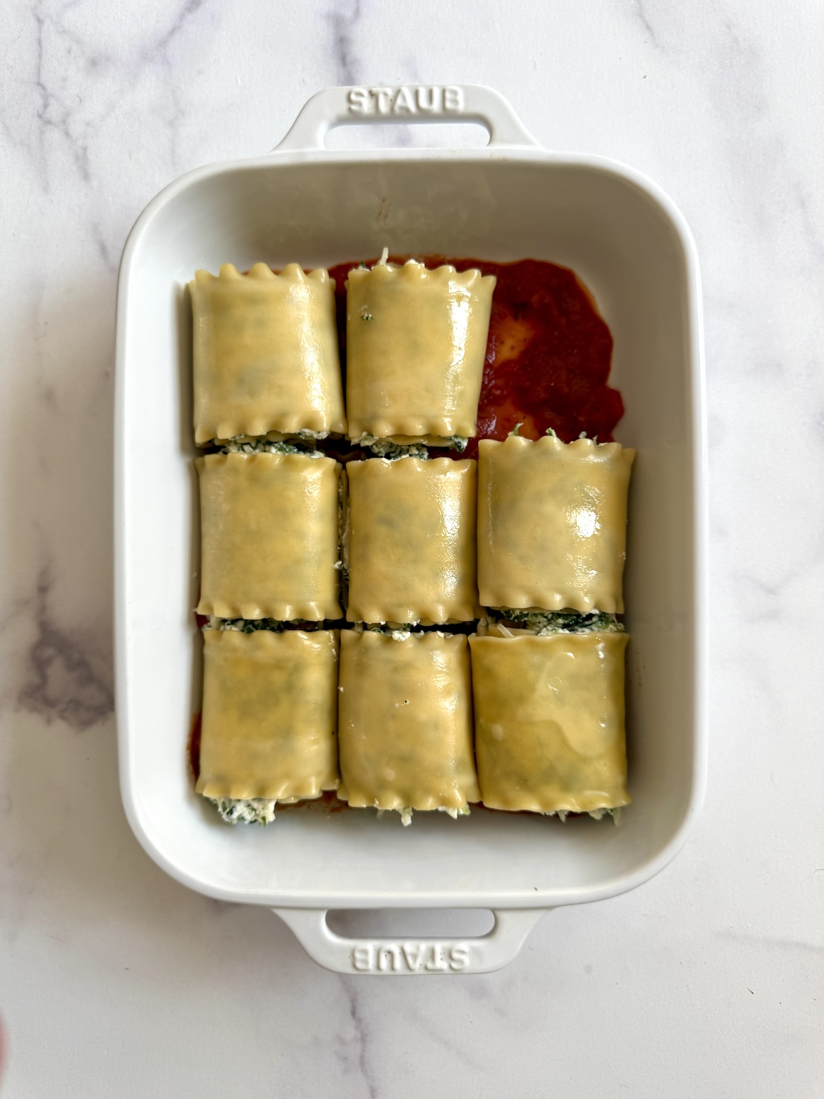 Lasagna rolls in a baking dish.