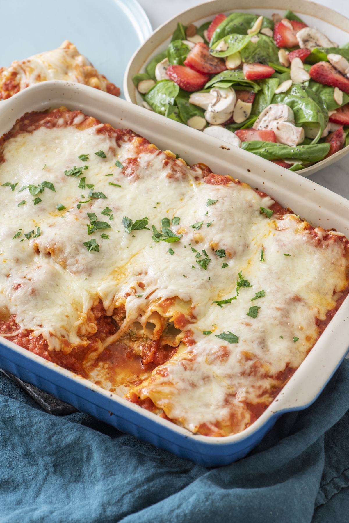 Lasagna rolls in a baking dish.