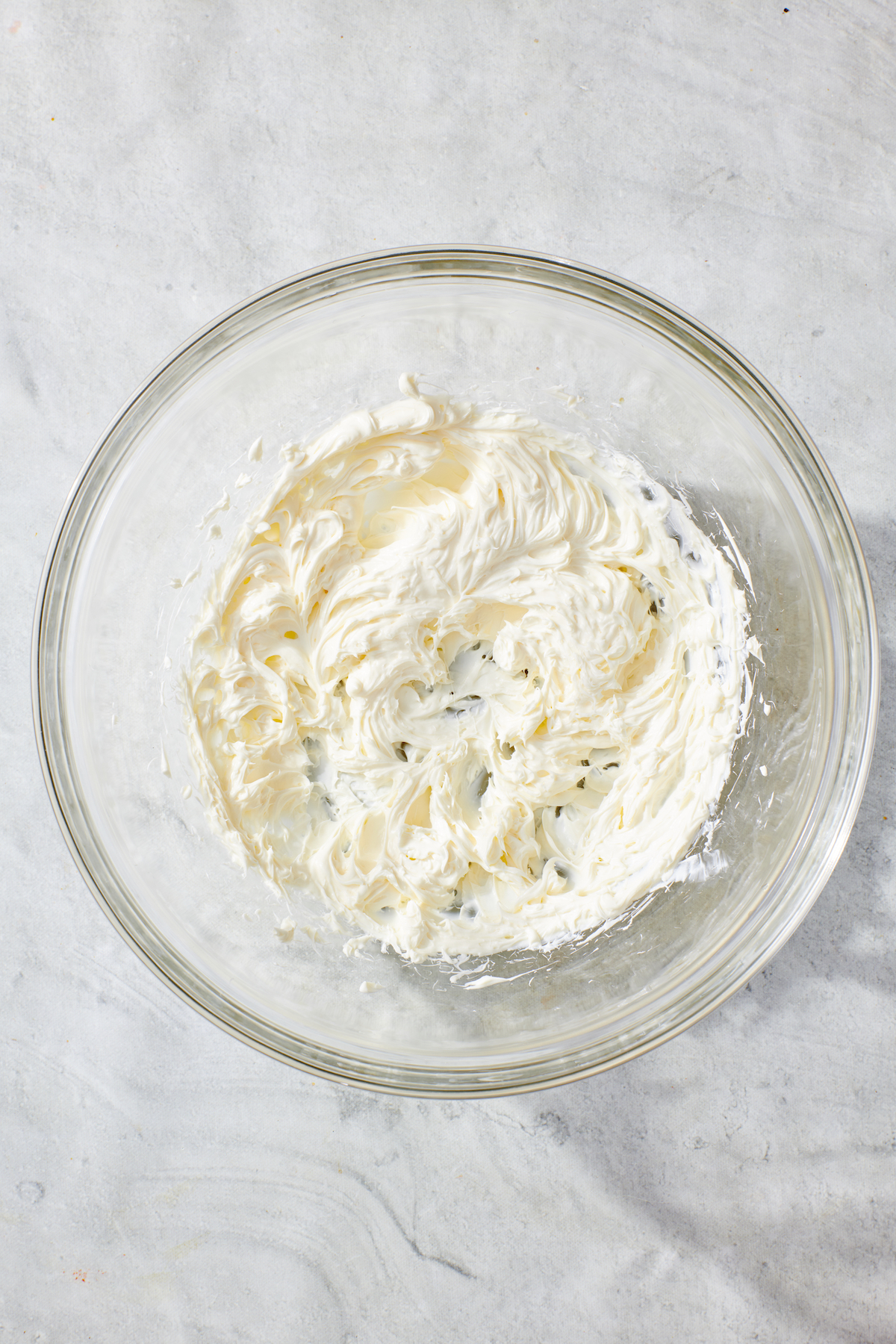 Whipped cream cheese in mixing bowl.
