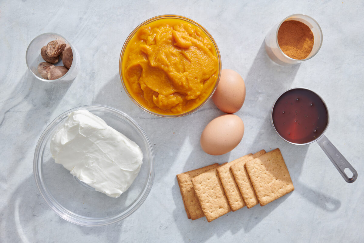 Overhead image of Mini Pumpkin Cheesecake ingredients.