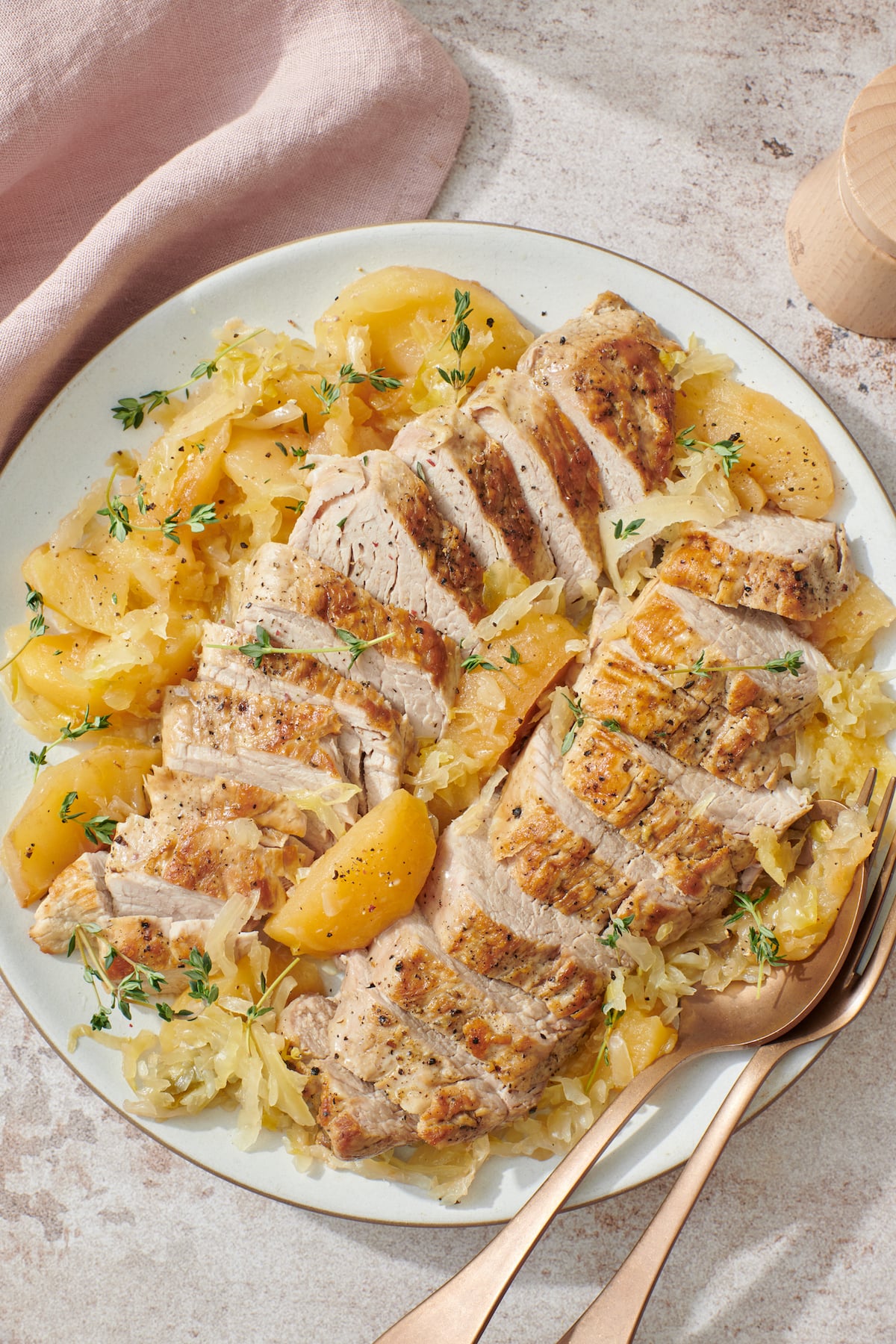 Pork tenderloin served over apples and sauerkraut.