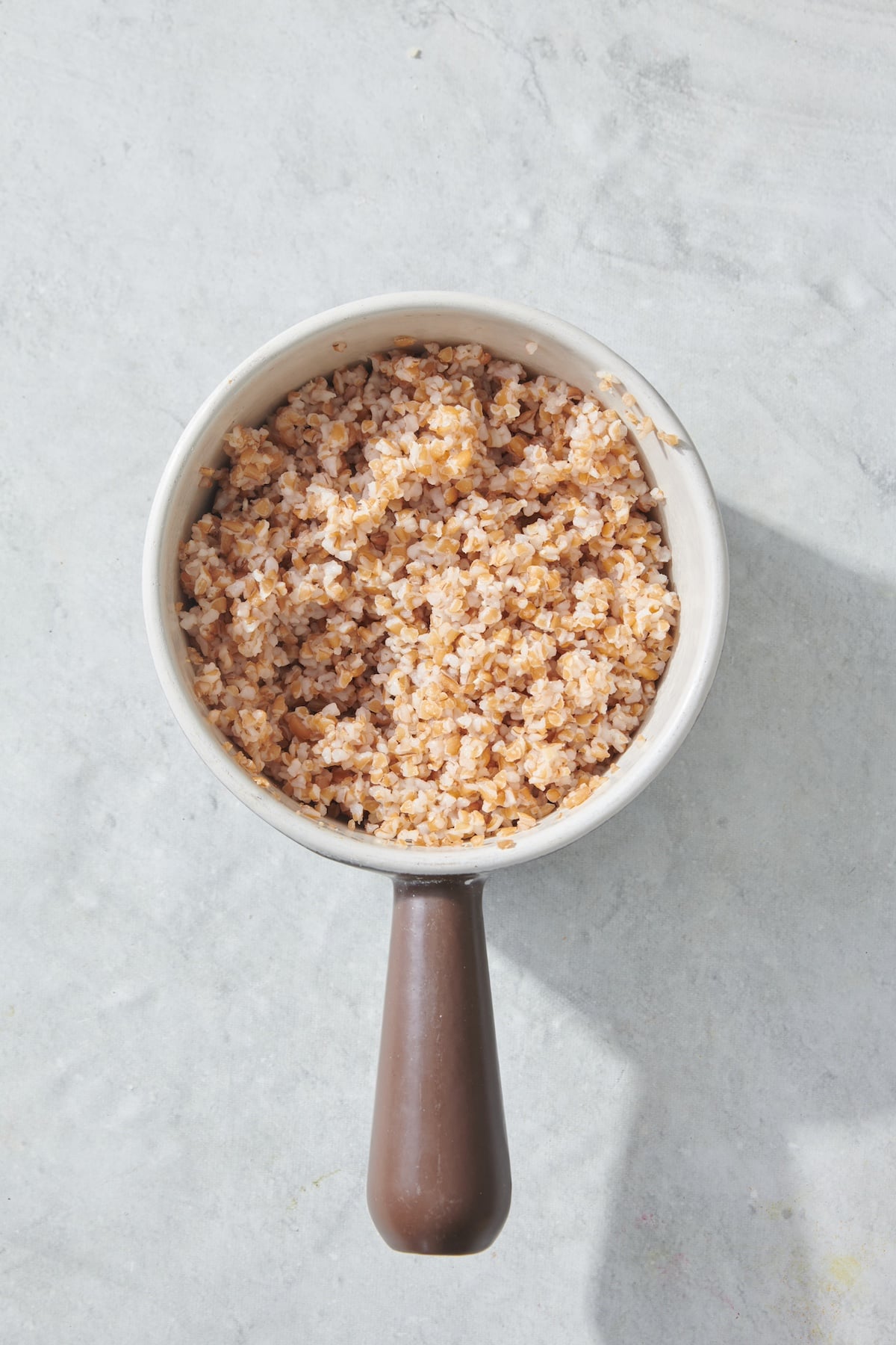 Cooked bulgar wheat in a pot.
