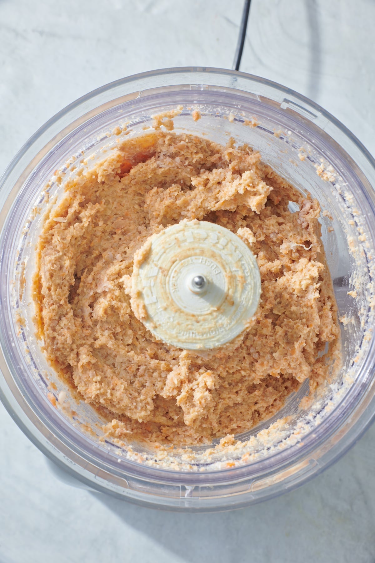 Veggie burger mixture in food processor.