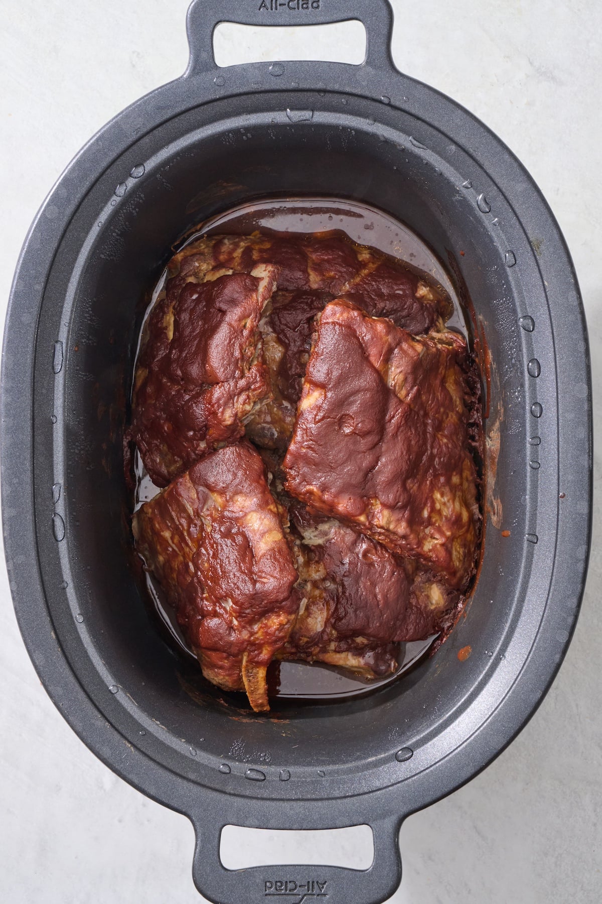 Ribs in crock pot after cooking.