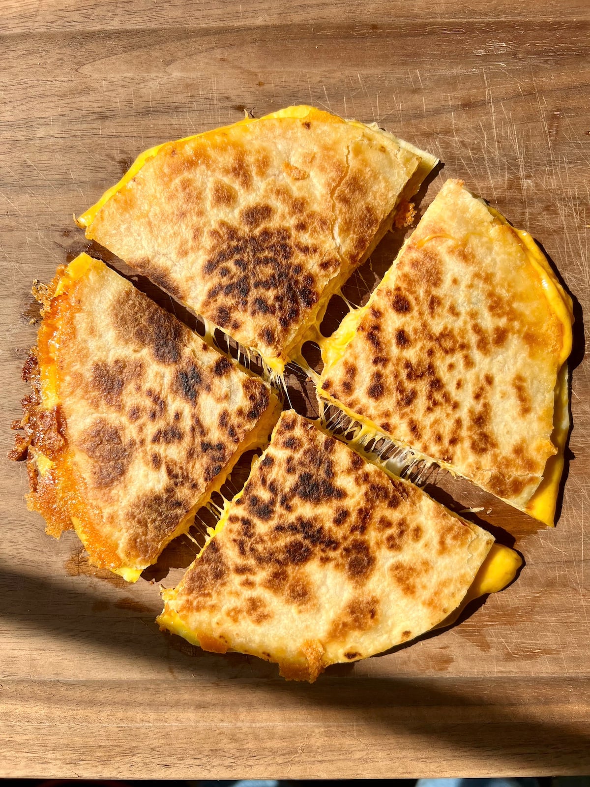 Breakfast quesadilla cut into wedges.