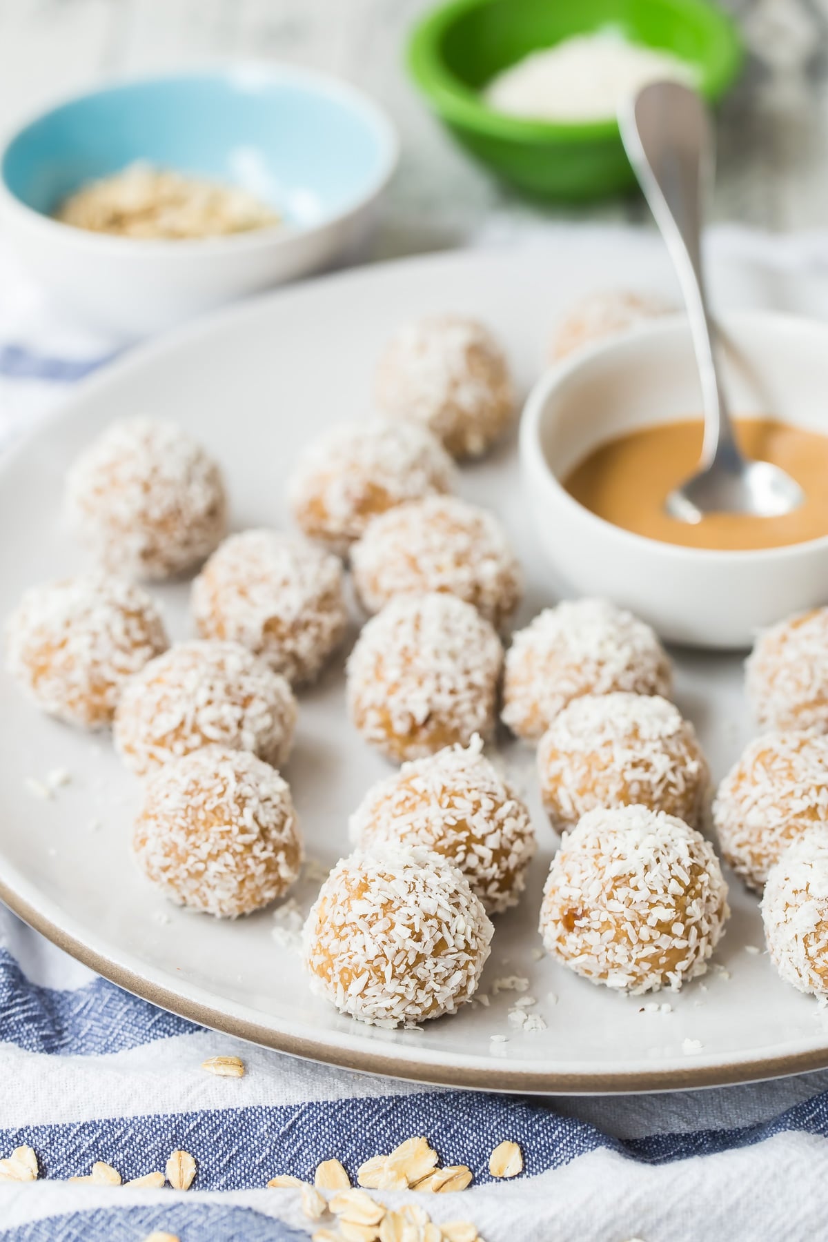 Coconut Peanut Butter Oatmeal Balls on a plate.