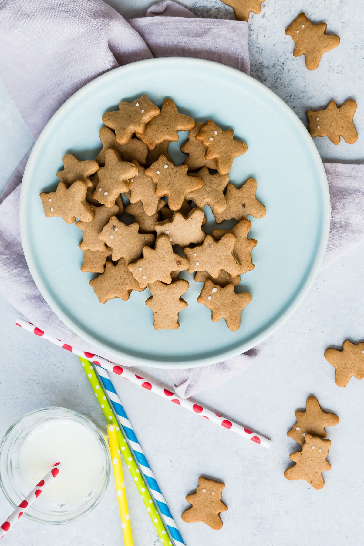 Homemade bear-shaped graham crackers on light blue plate.