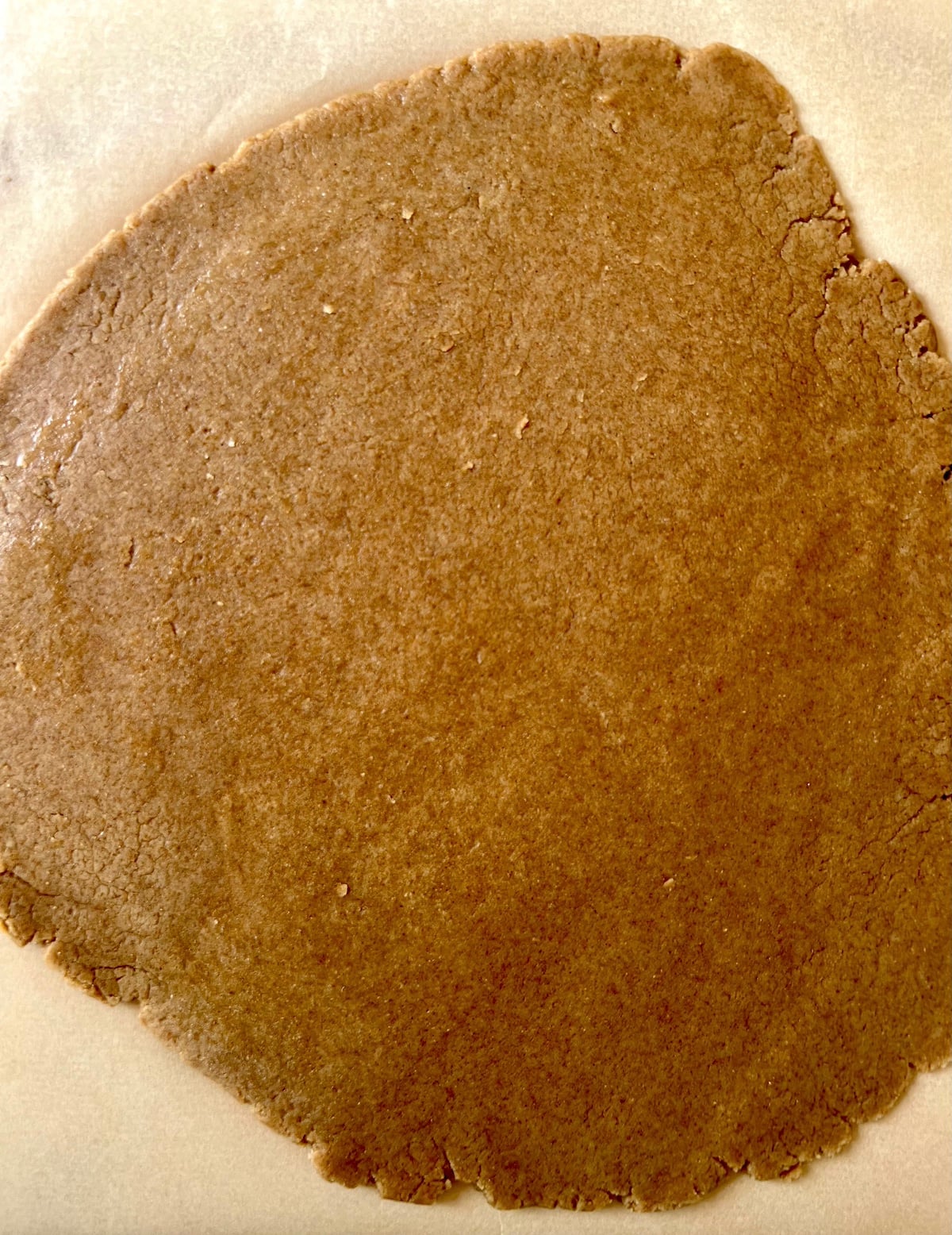 Rolled out graham cracker dough.