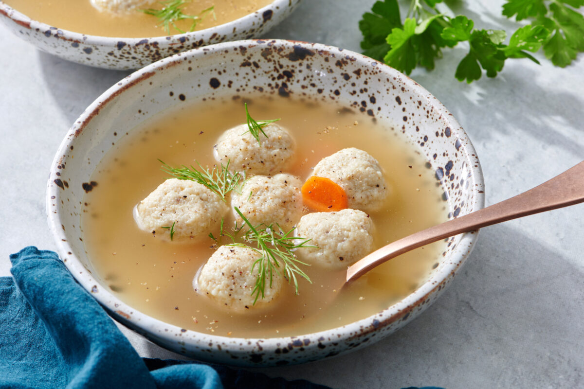 Bowl of mini matzah ball soup.