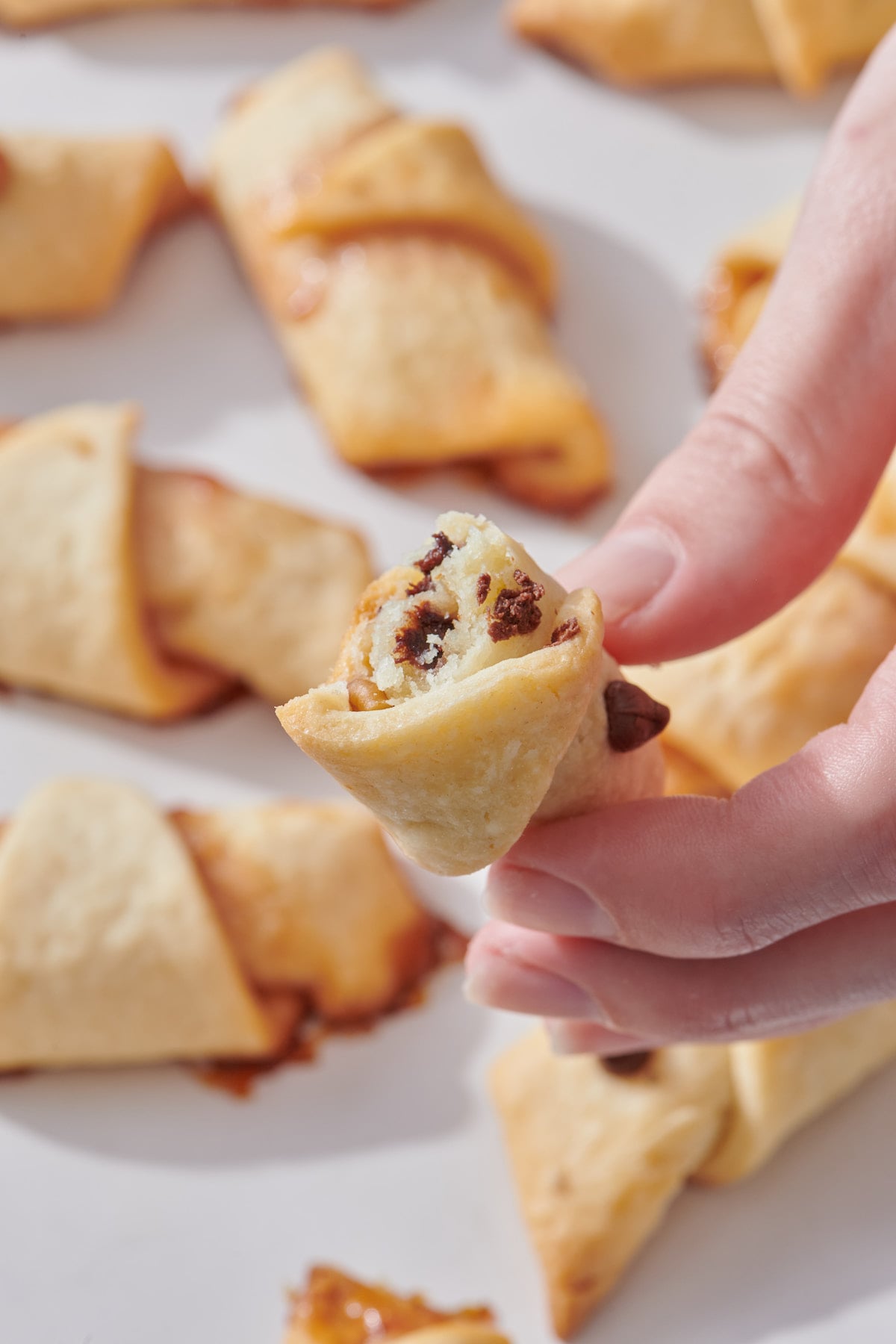 Hand showing the inside of rugelach.