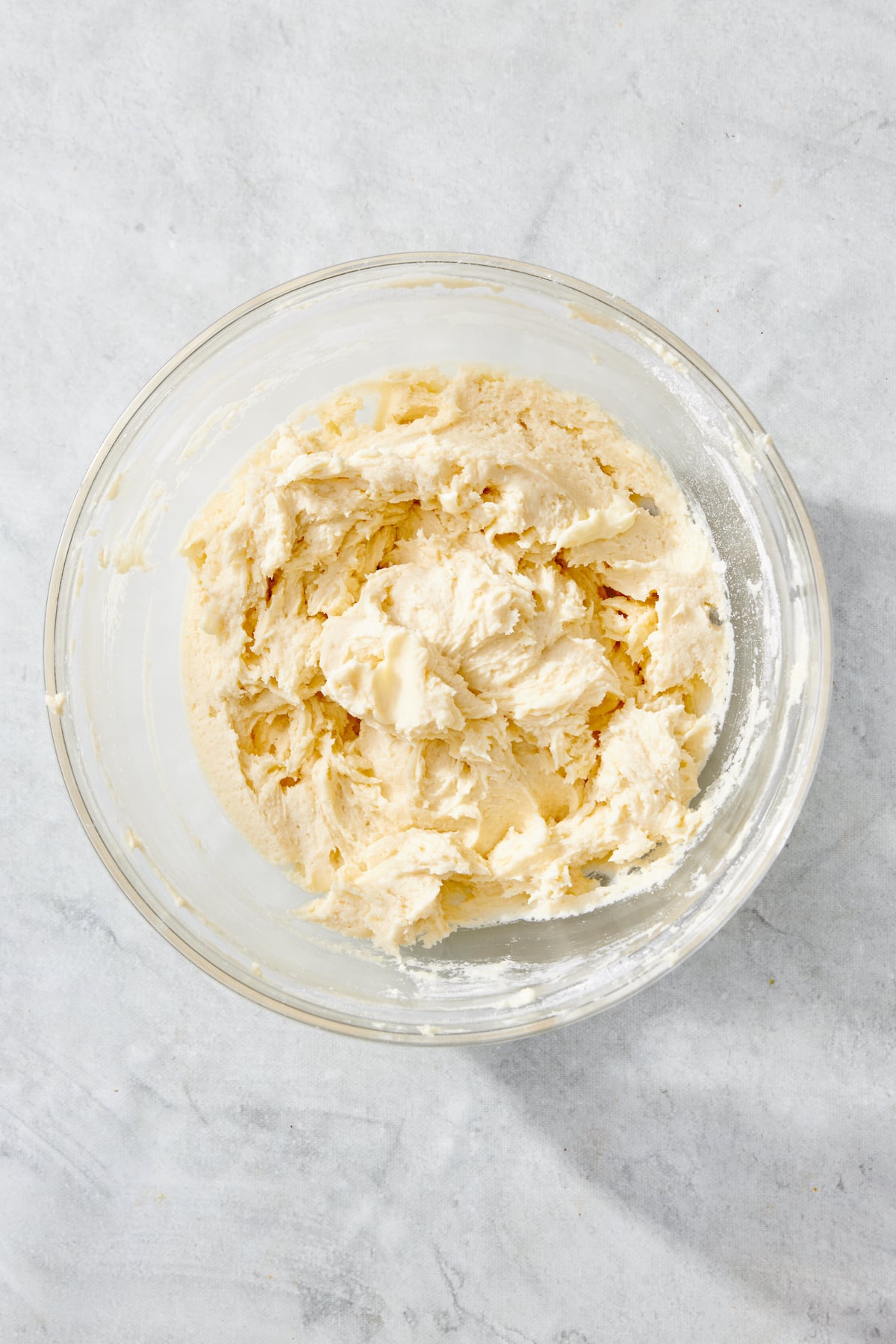 Rugelach dough ingredients mixed in a bowl.