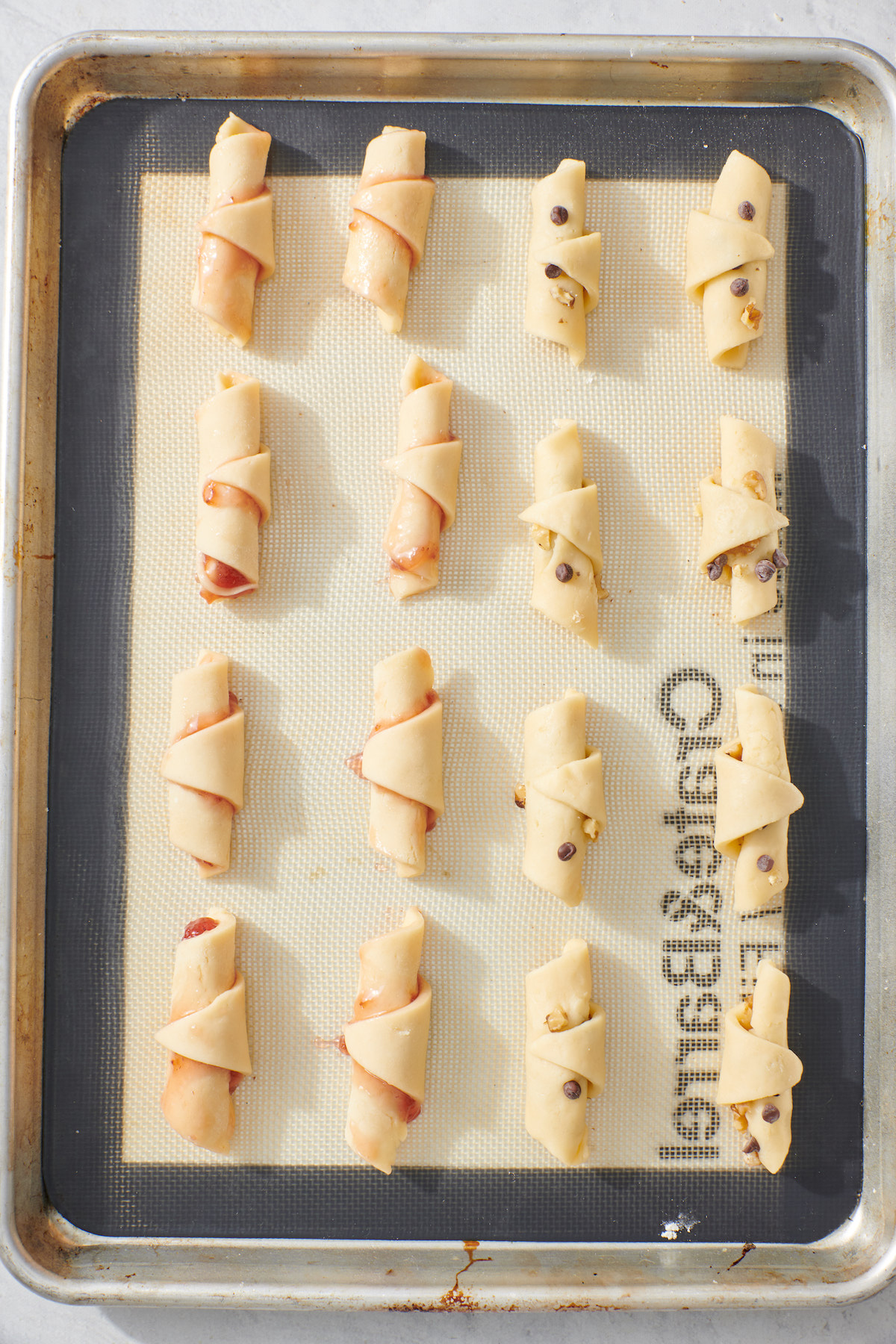 Rugelach on baking sheet before baked.