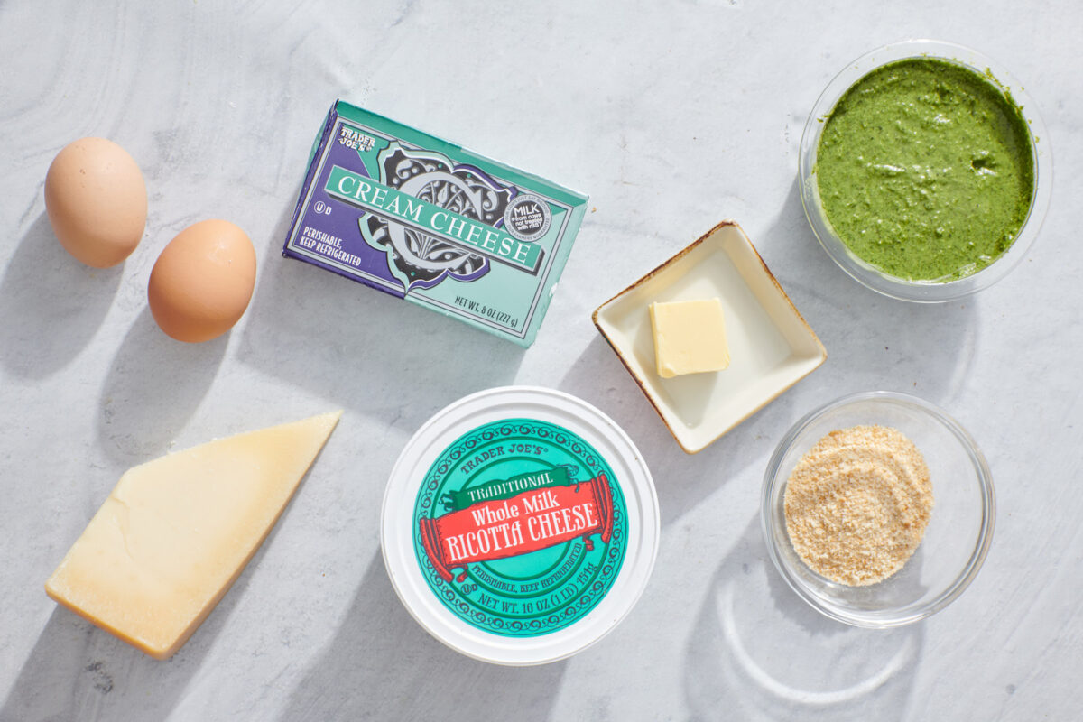 The ingredients for savory basil pesto cheesecake dip.