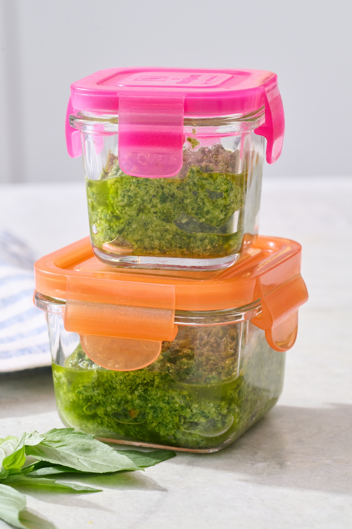 Basil pesto in storage containers.