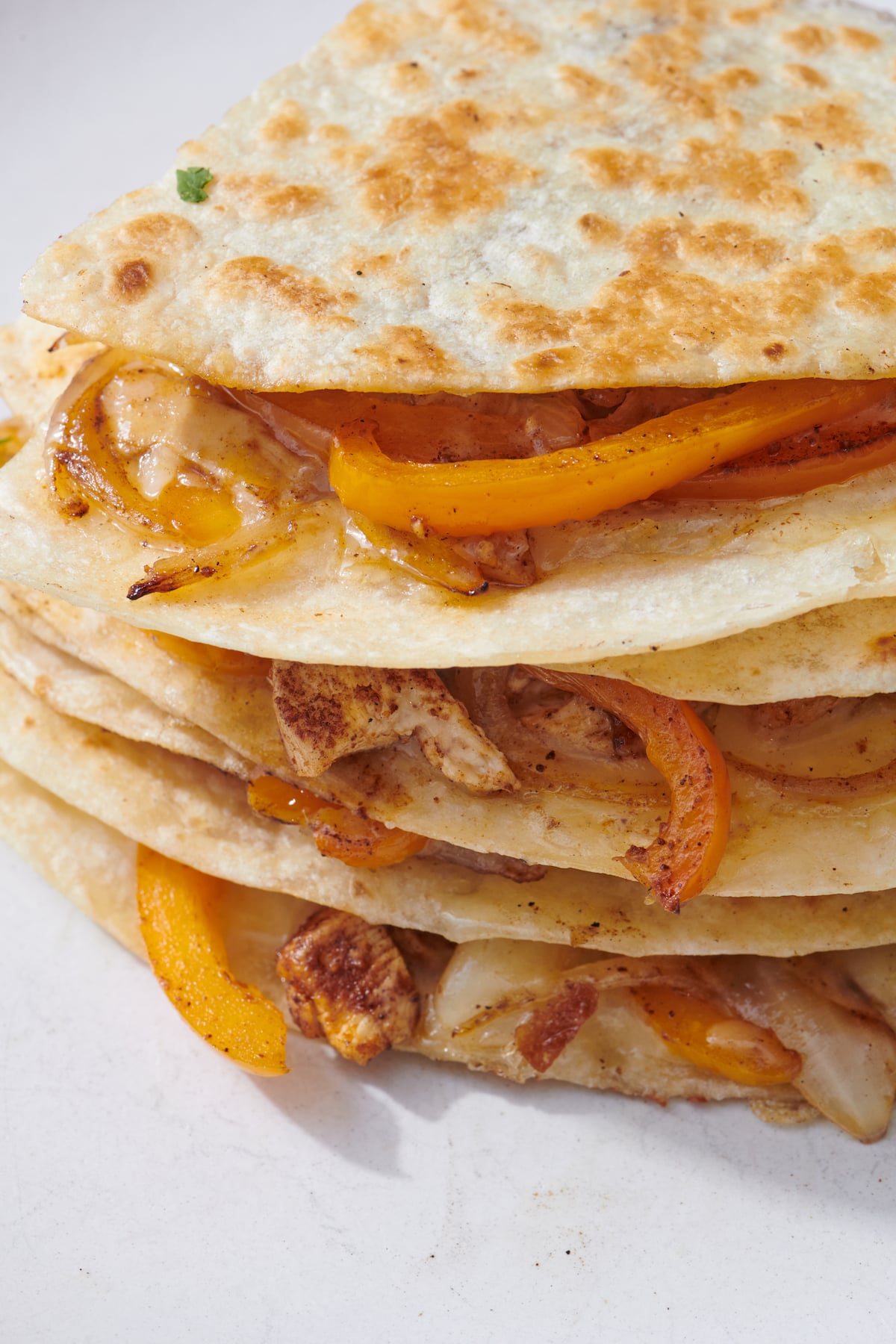 Stack of chicken fajita quesadilla wedges.