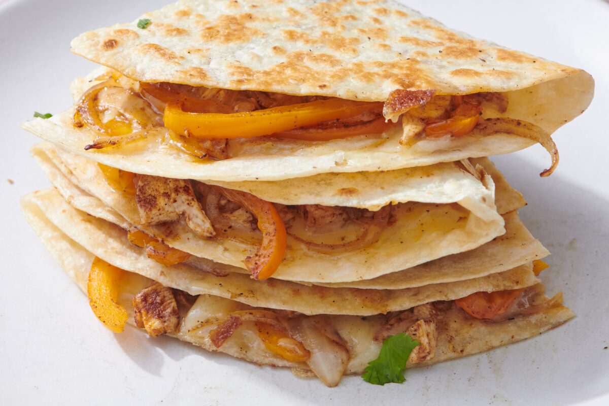 Stack of chicken fajita quesadilla wedges.