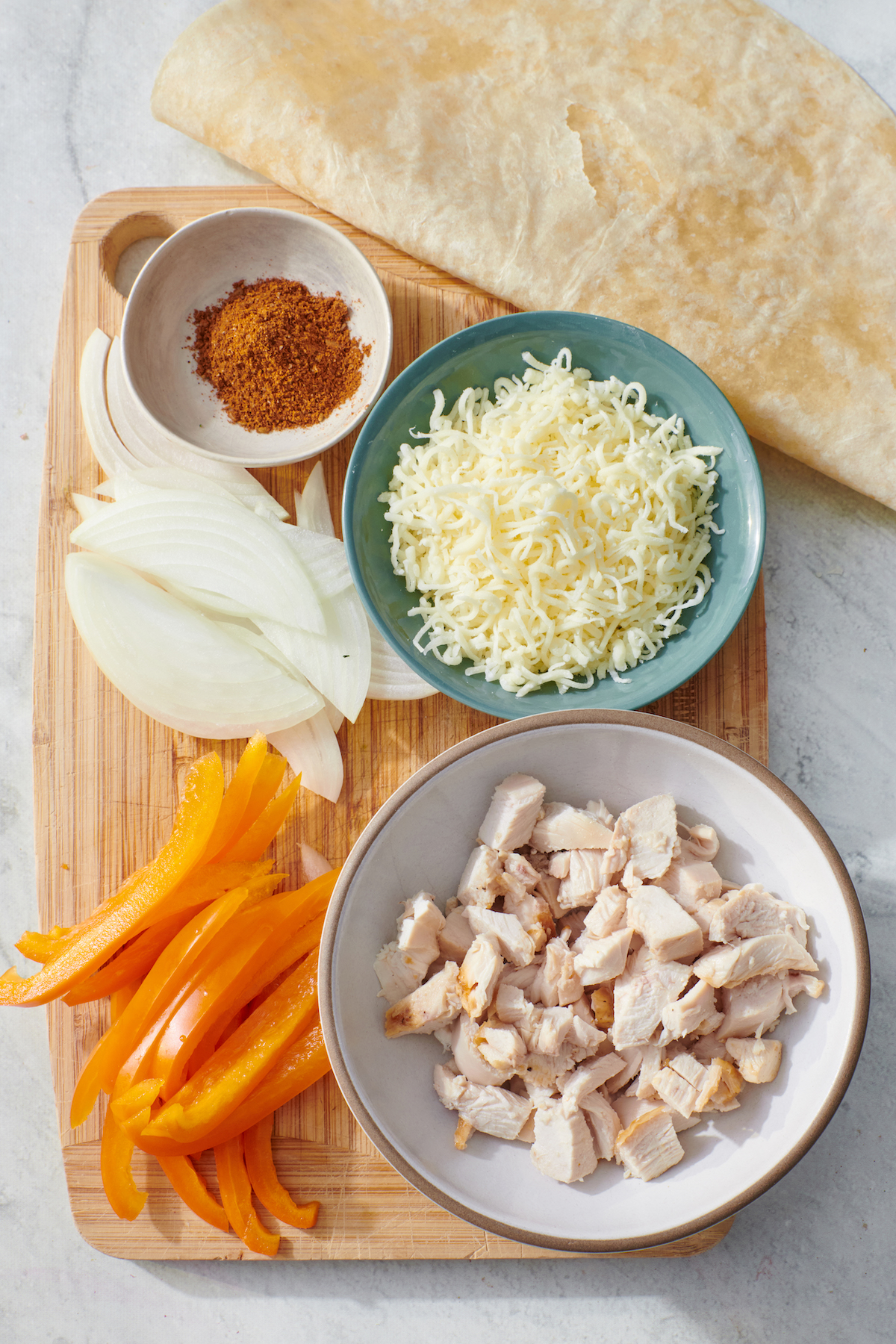 Ingredients to make chicken fajita quesadillas