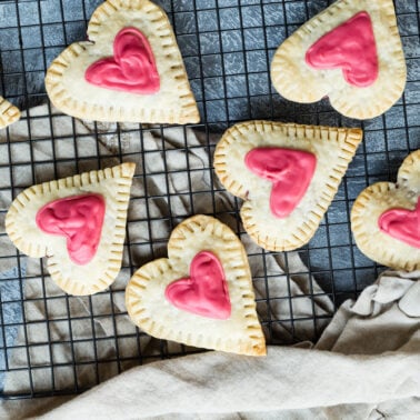Raspberry cream cheese filled heart-shaped tarts.