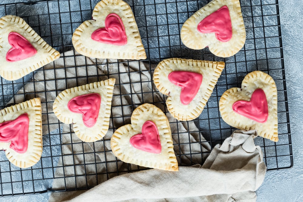 Raspberry cream cheese filled heart-shaped tarts.
