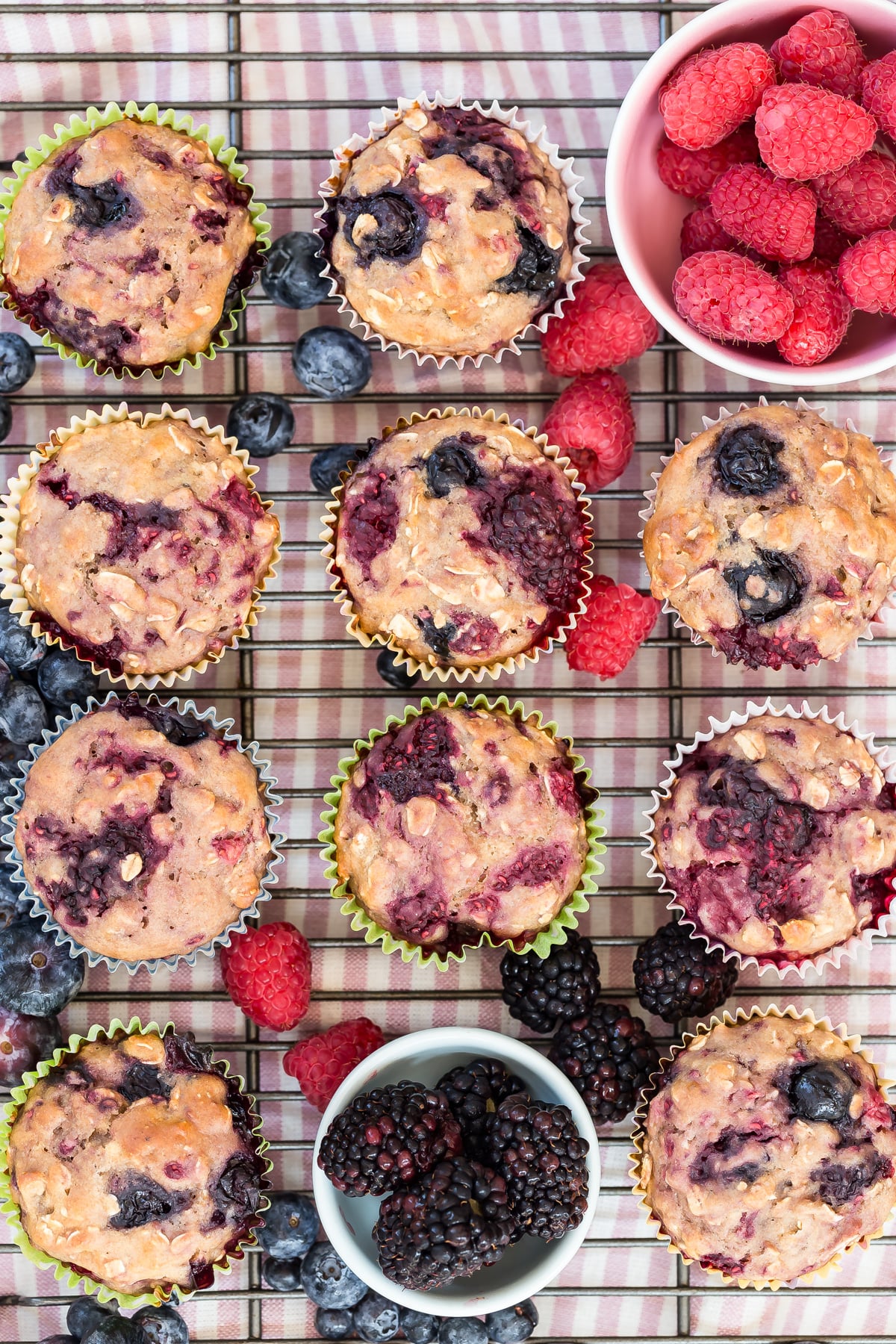 Very berry muffins on cooling rack.