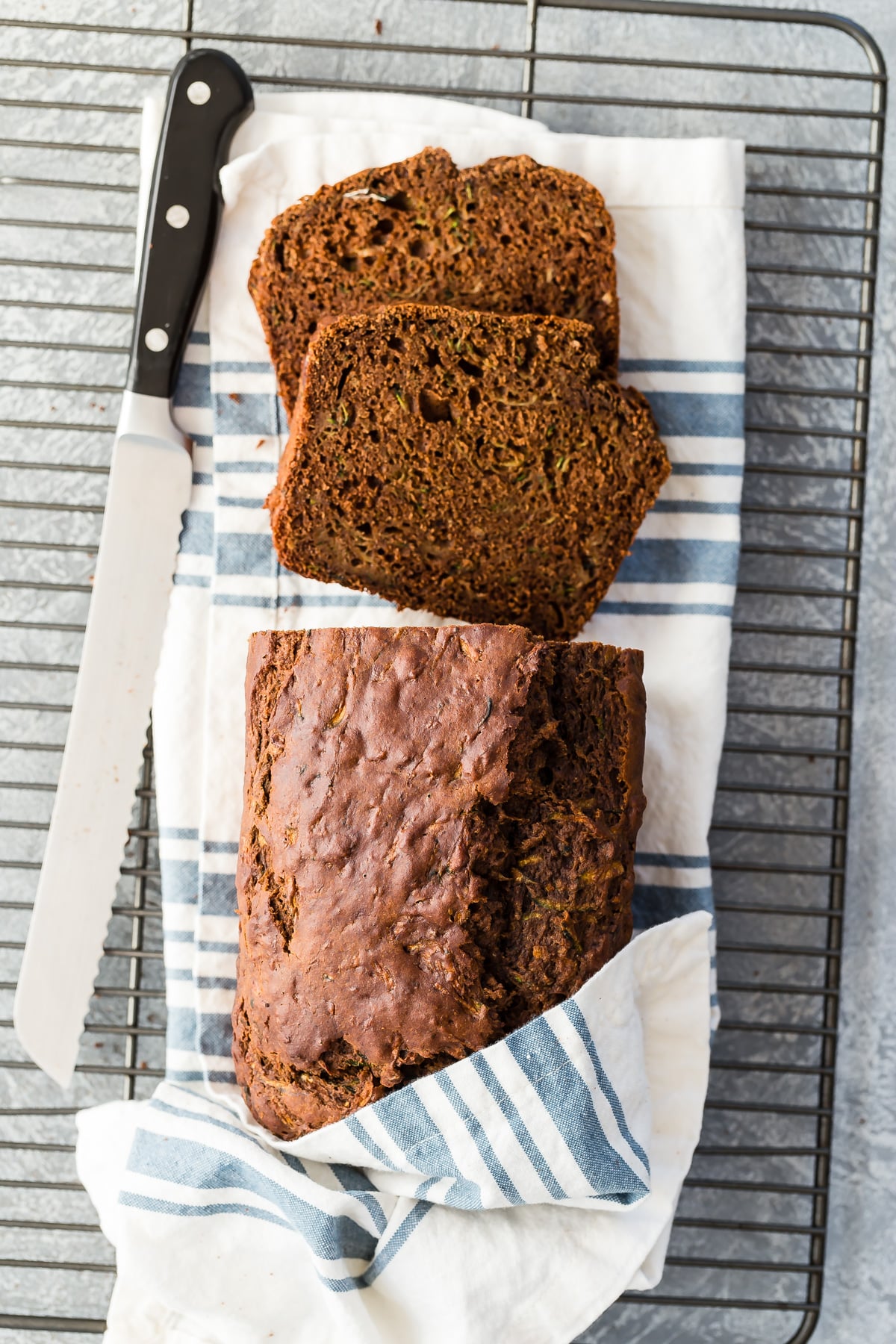 Chocolate zucchini bread on wire rack.