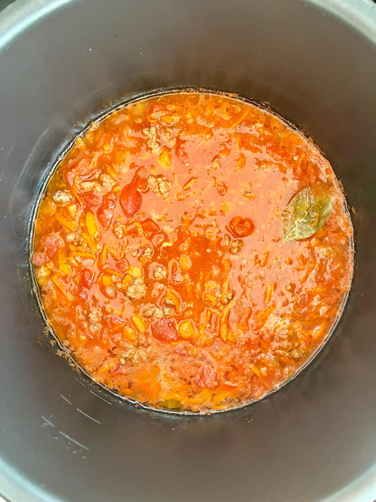 Crock Pot pasta sauce with ground beef cooked in slow cooker.