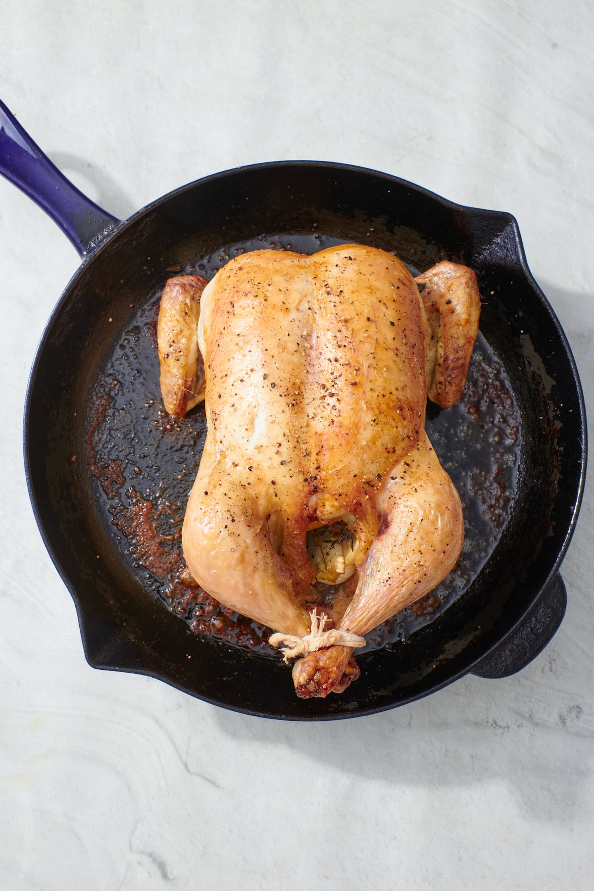 Roasted chicken in a cast iron skillet.