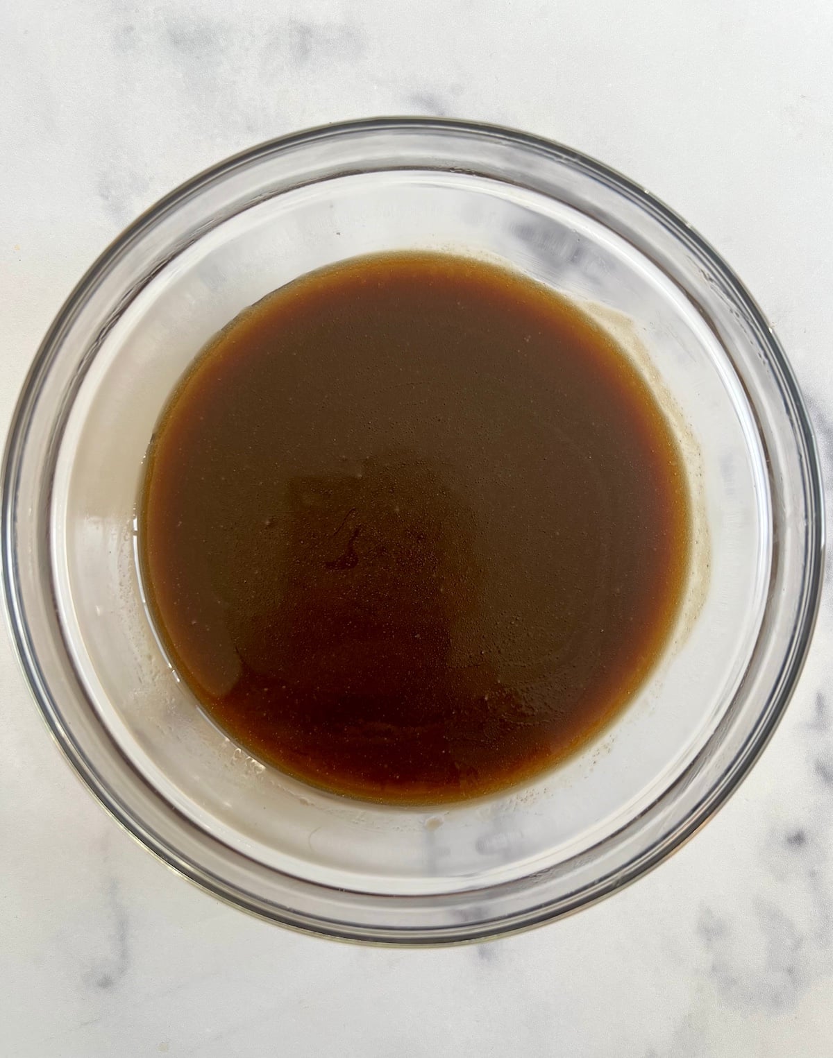 Vegan cookies wet ingredients in mixing bowl.