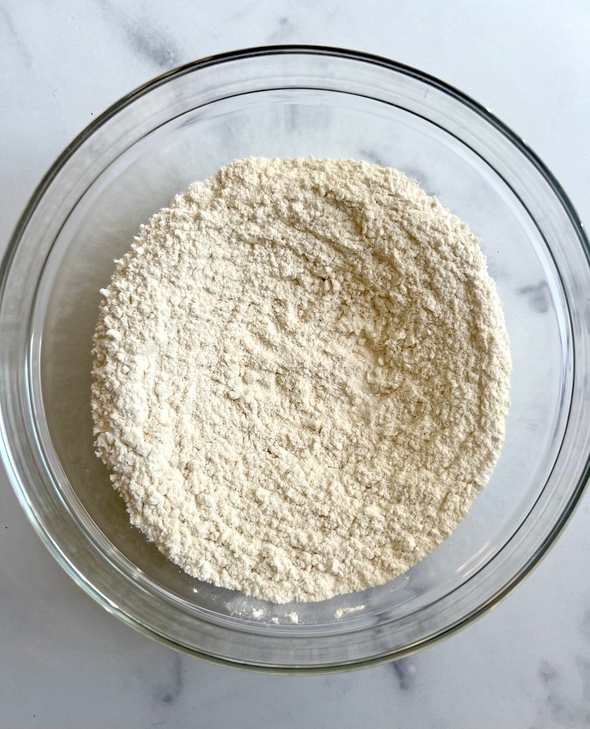 Vegan chocolate chip cookies dry ingredients in mixing bowl.