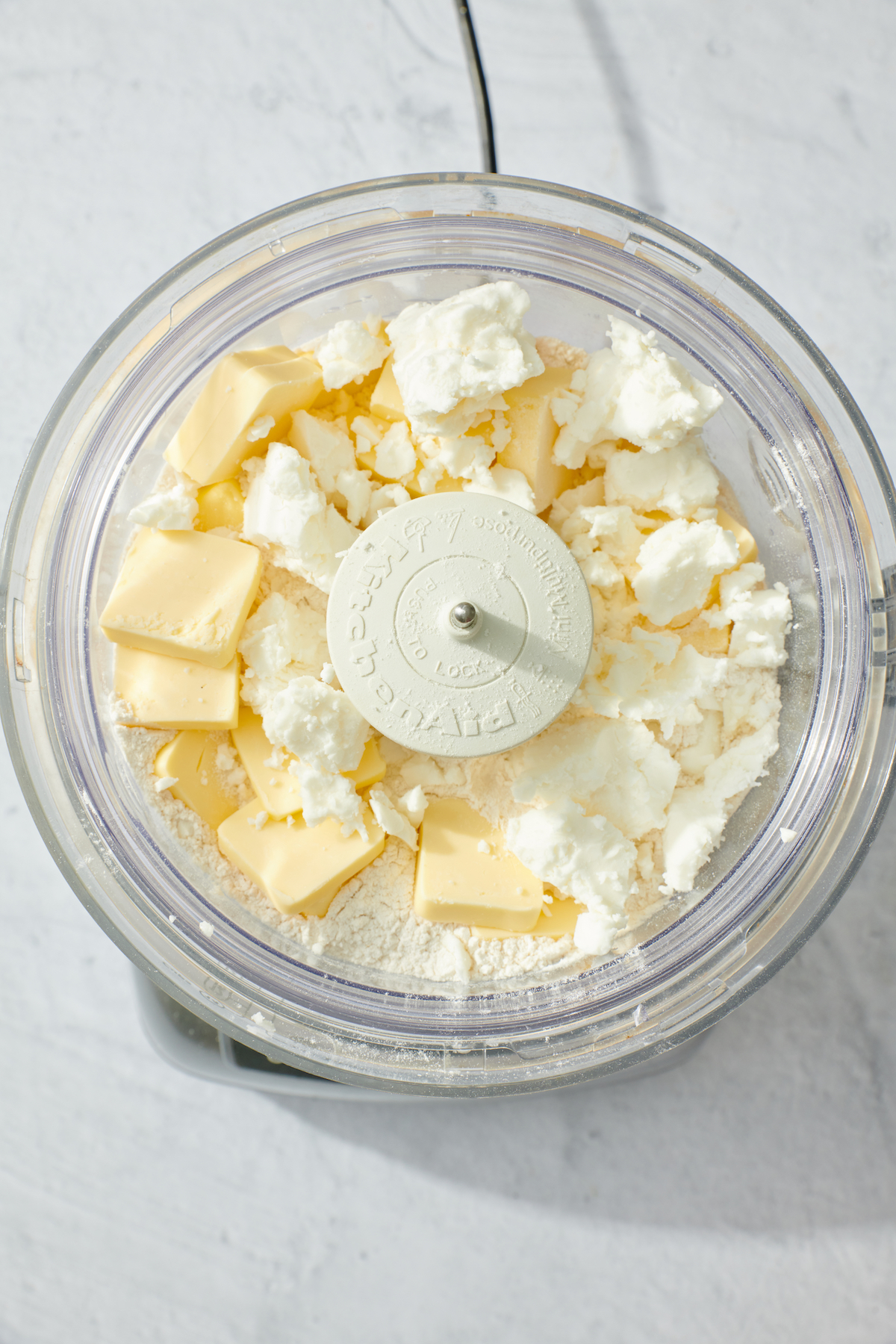 Chilled butter and vegetable shortening added to food processor.