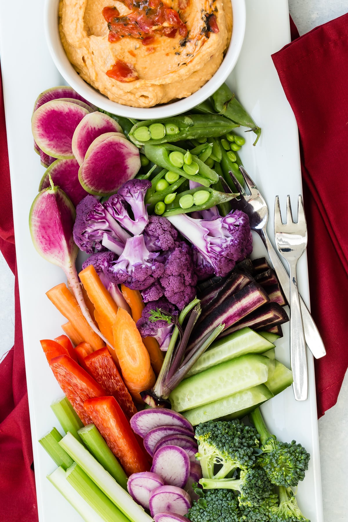 Red Bell Pepper Hummus served with fresh vegetables for dipping.