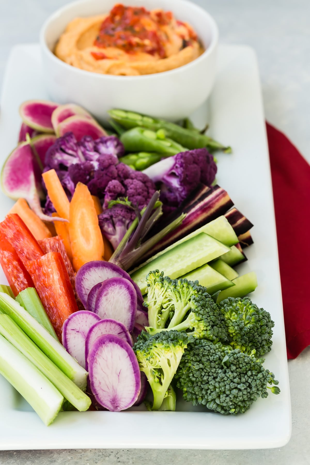 Red Bell Pepper Hummus served with vegetables.