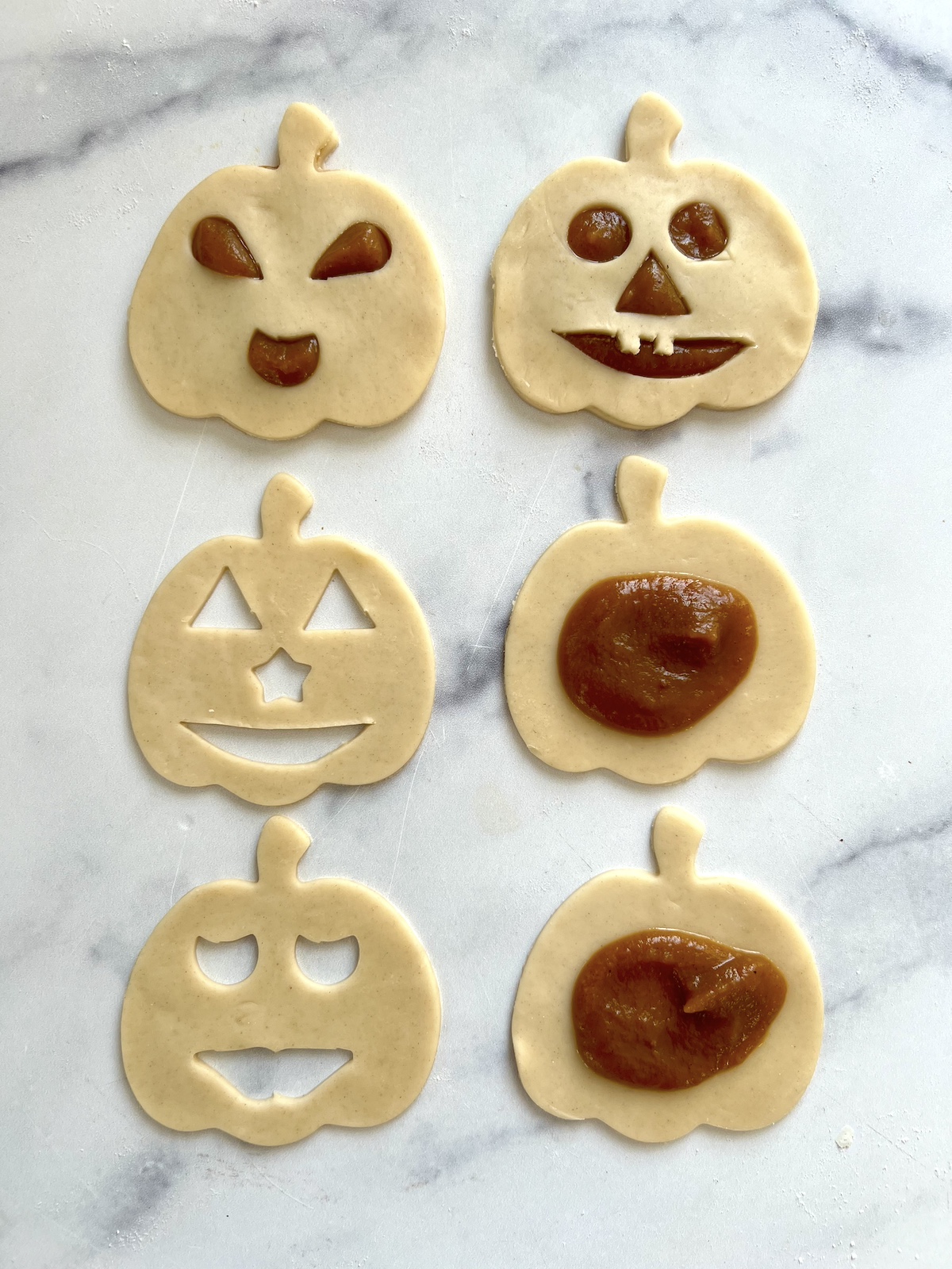 Assembling pumpkin pie pop tarts.