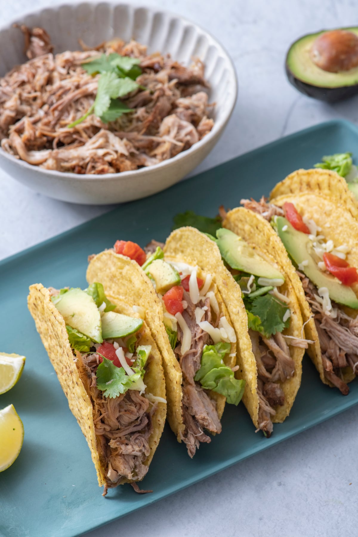 Slow Cooker Mexican Pulled Pork tacos on platter.